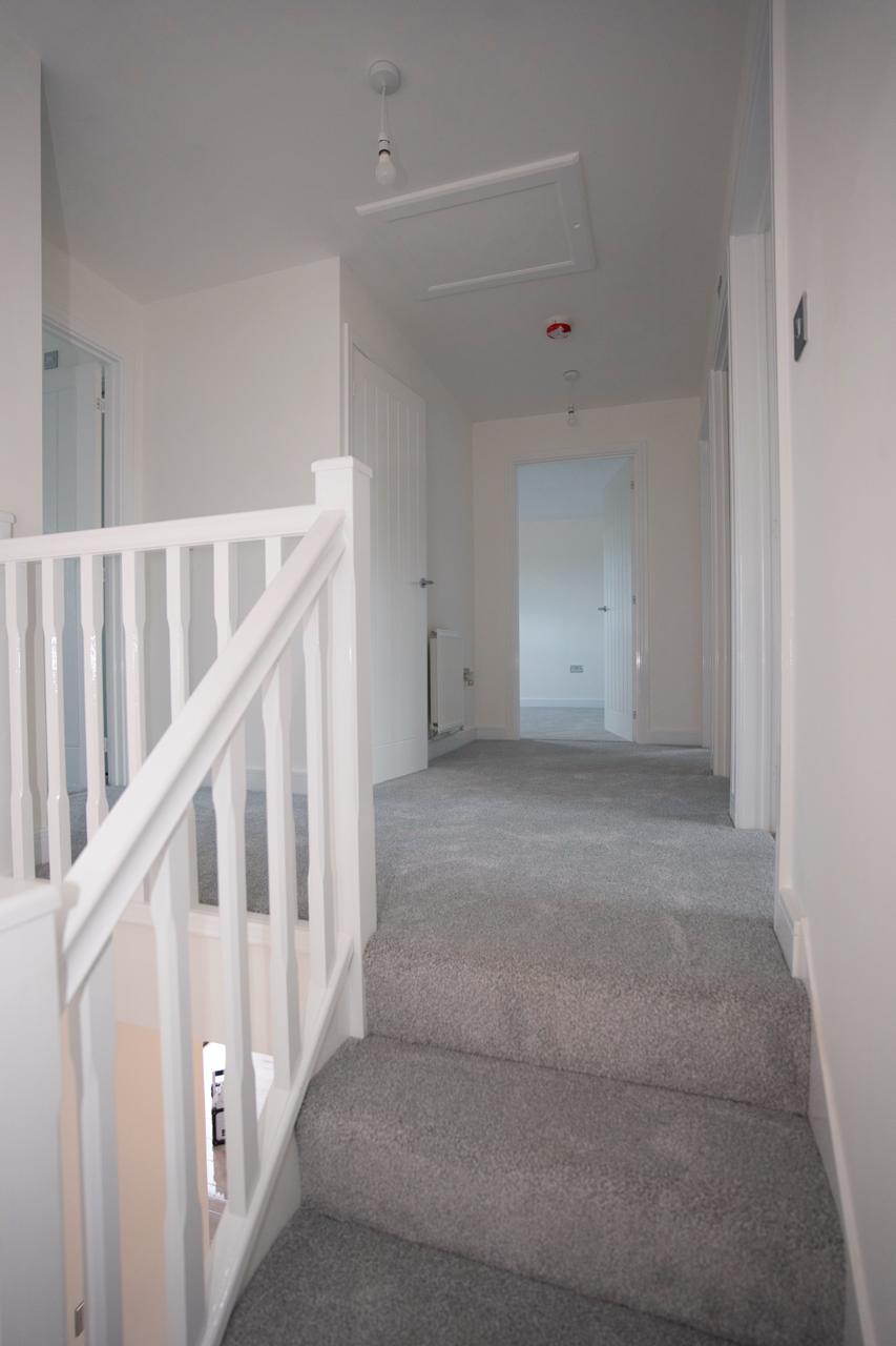 Staircase with white railing in a home interior